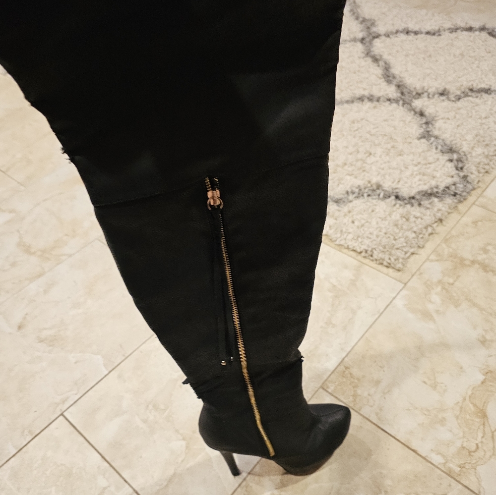 Thigh high black boots with gold zipper
